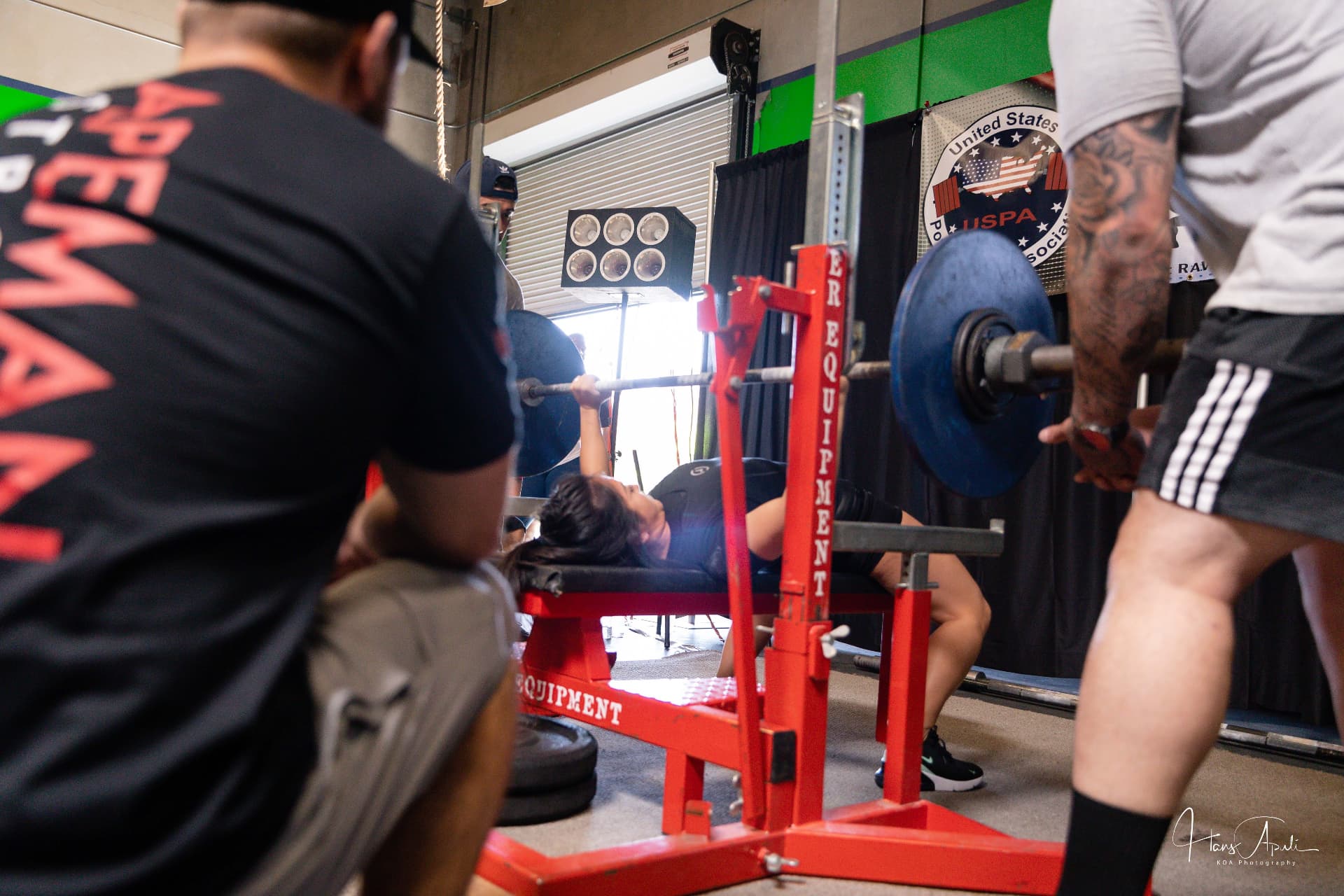 Jessica competing in a powerlifting bench press meet